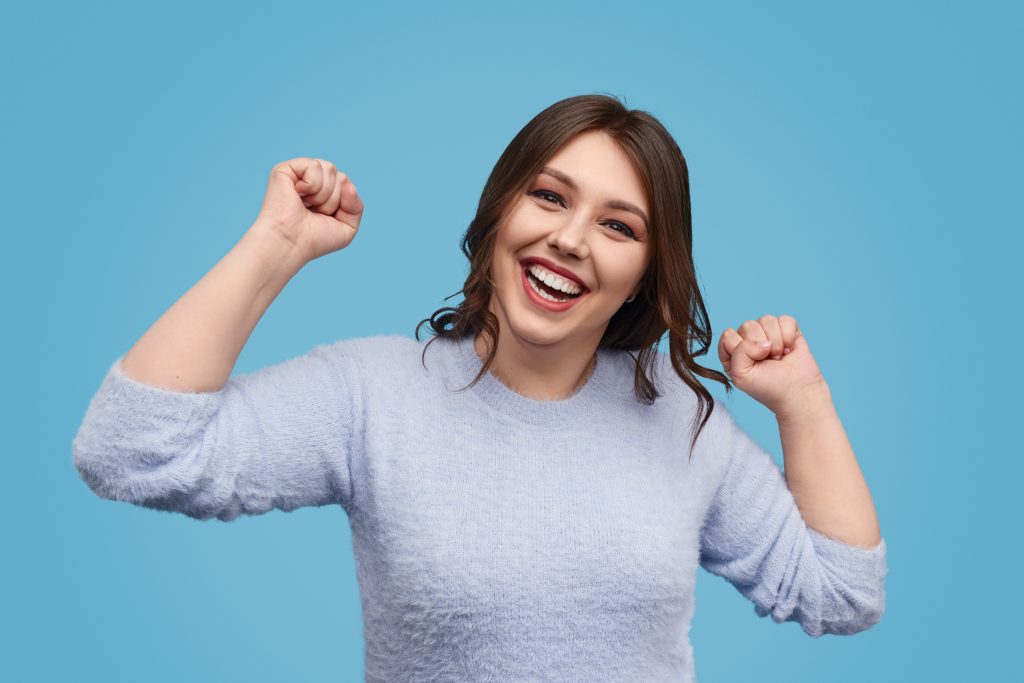 Chubby female celebrating success